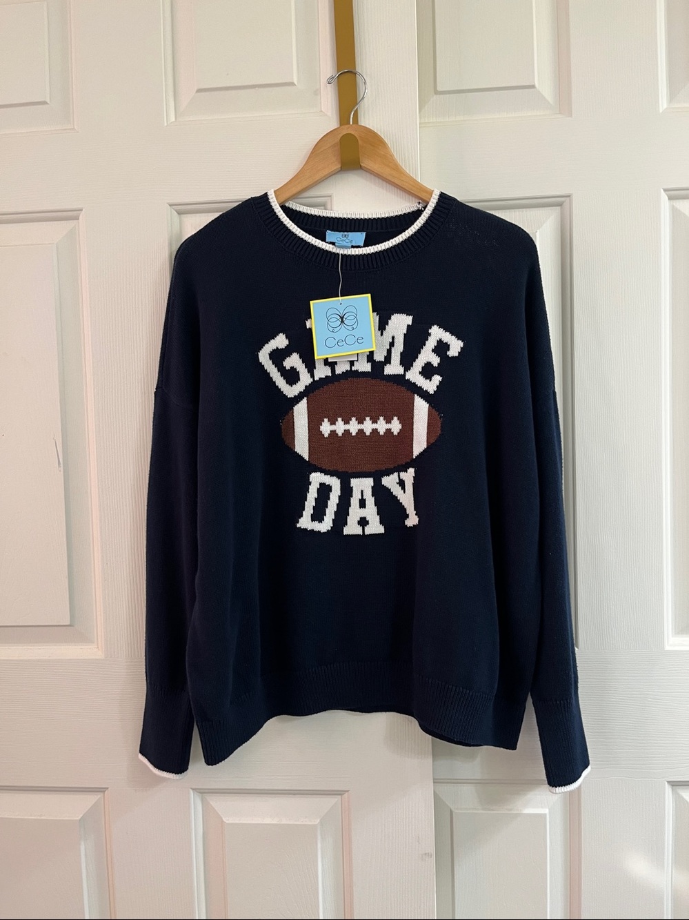 Fun CeCe Navy Crewneck Sweater for game day with Brown & White Football Graphic